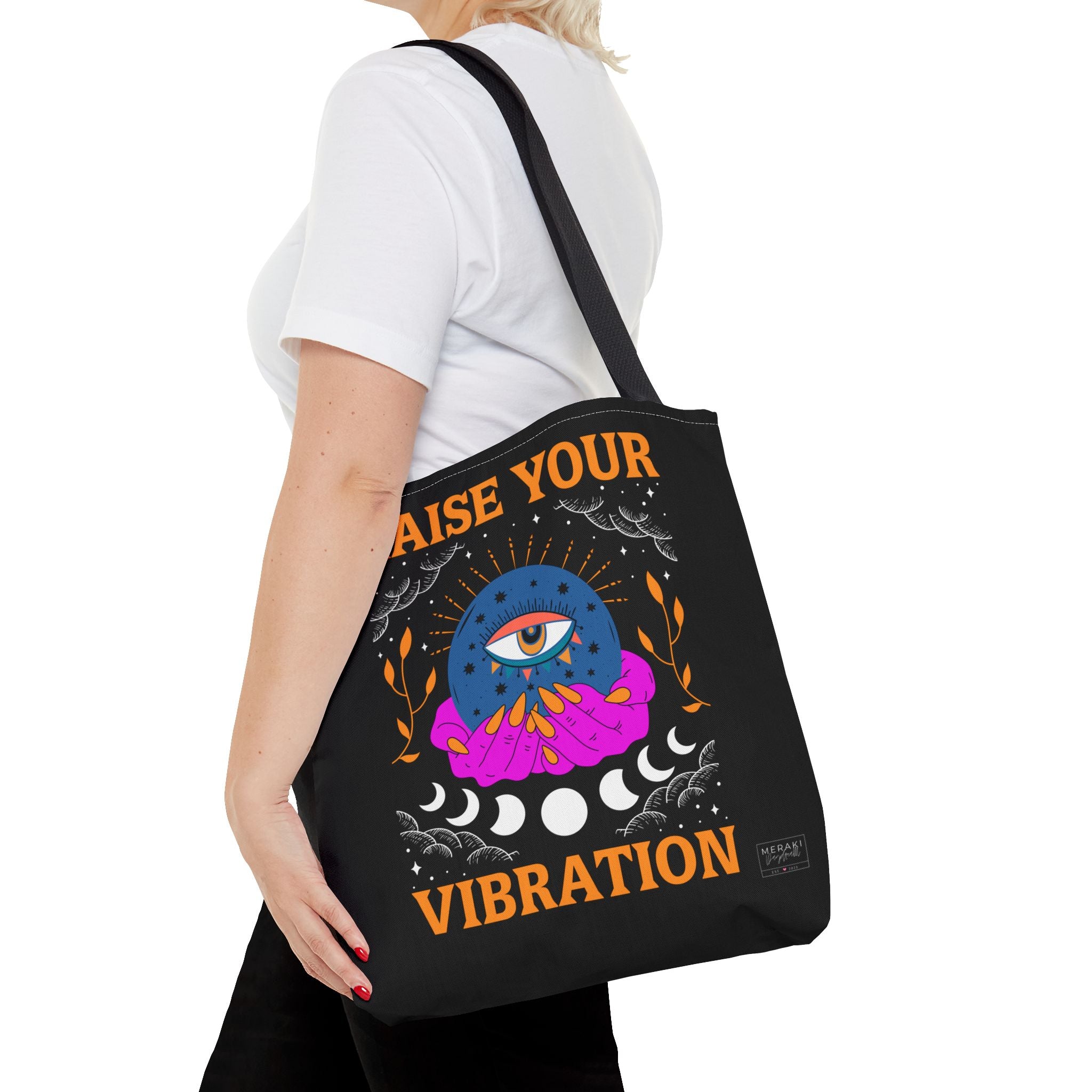 Female model wearing tote with affirmations journal inside