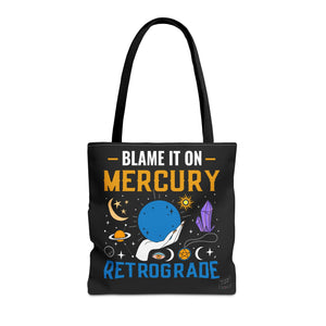 Front view of Blame It On Mercury Retrograde tote with black handles