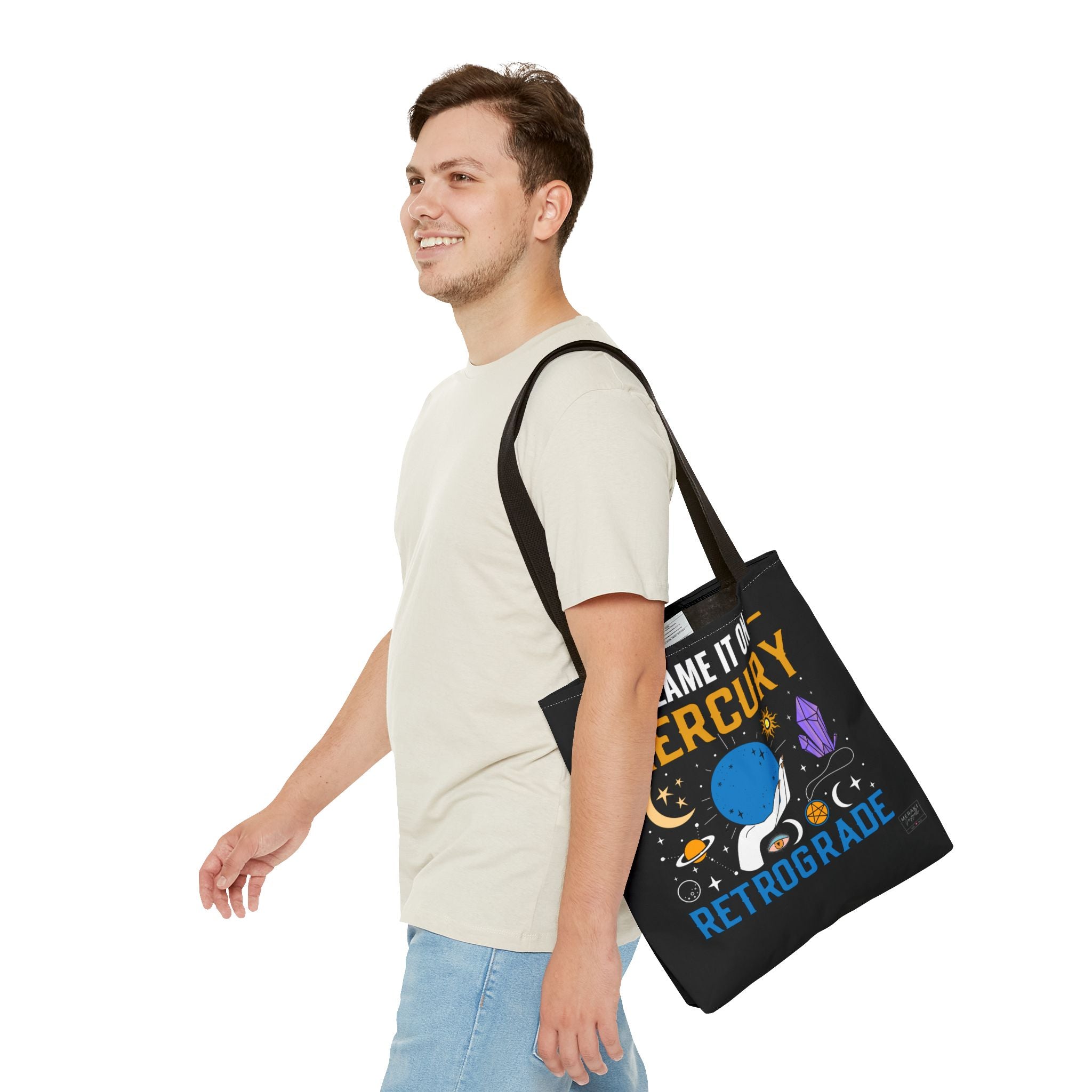 Man holding black handle astrology tote during errand run
