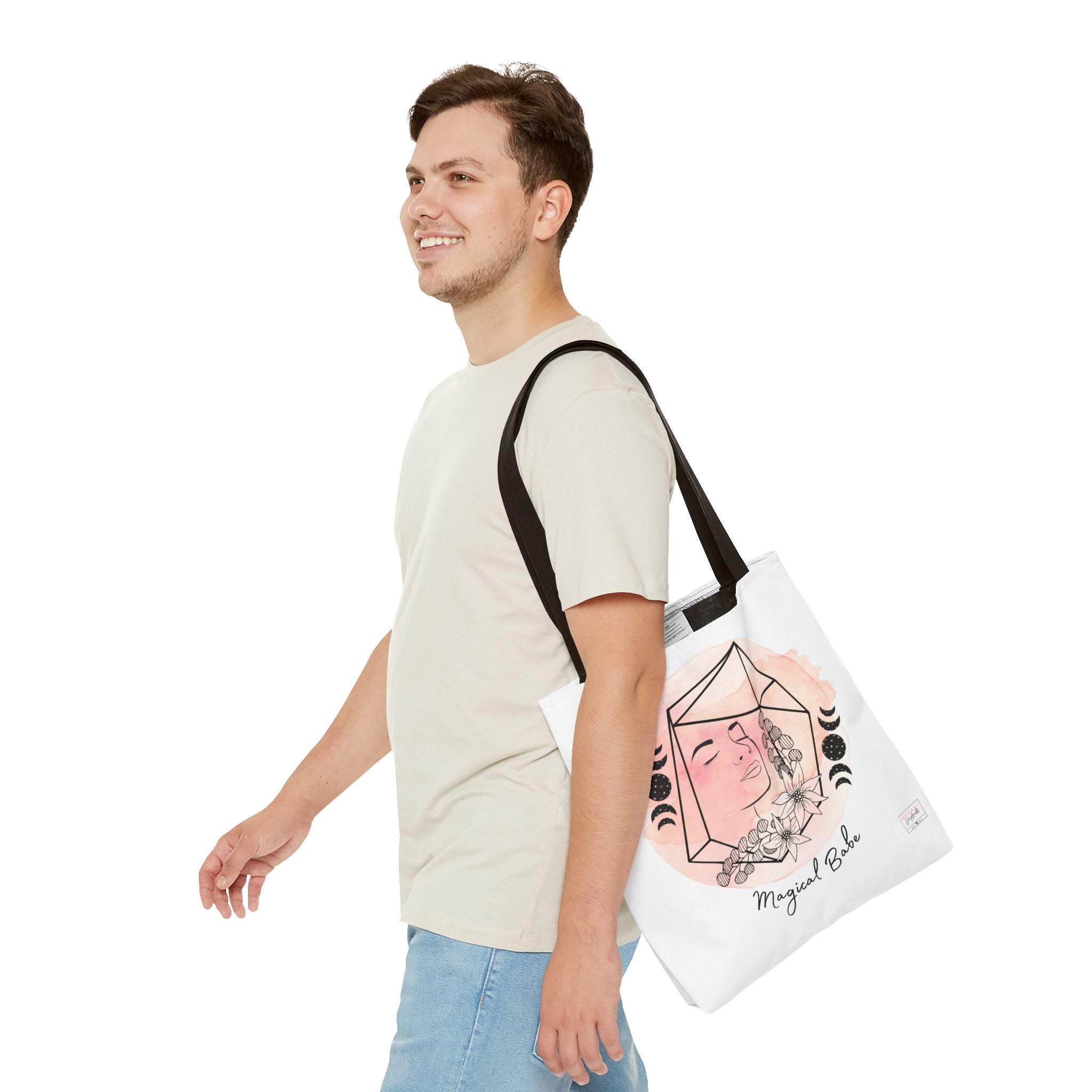 "Man holding black handle tote bag with crystals and notebook inside"