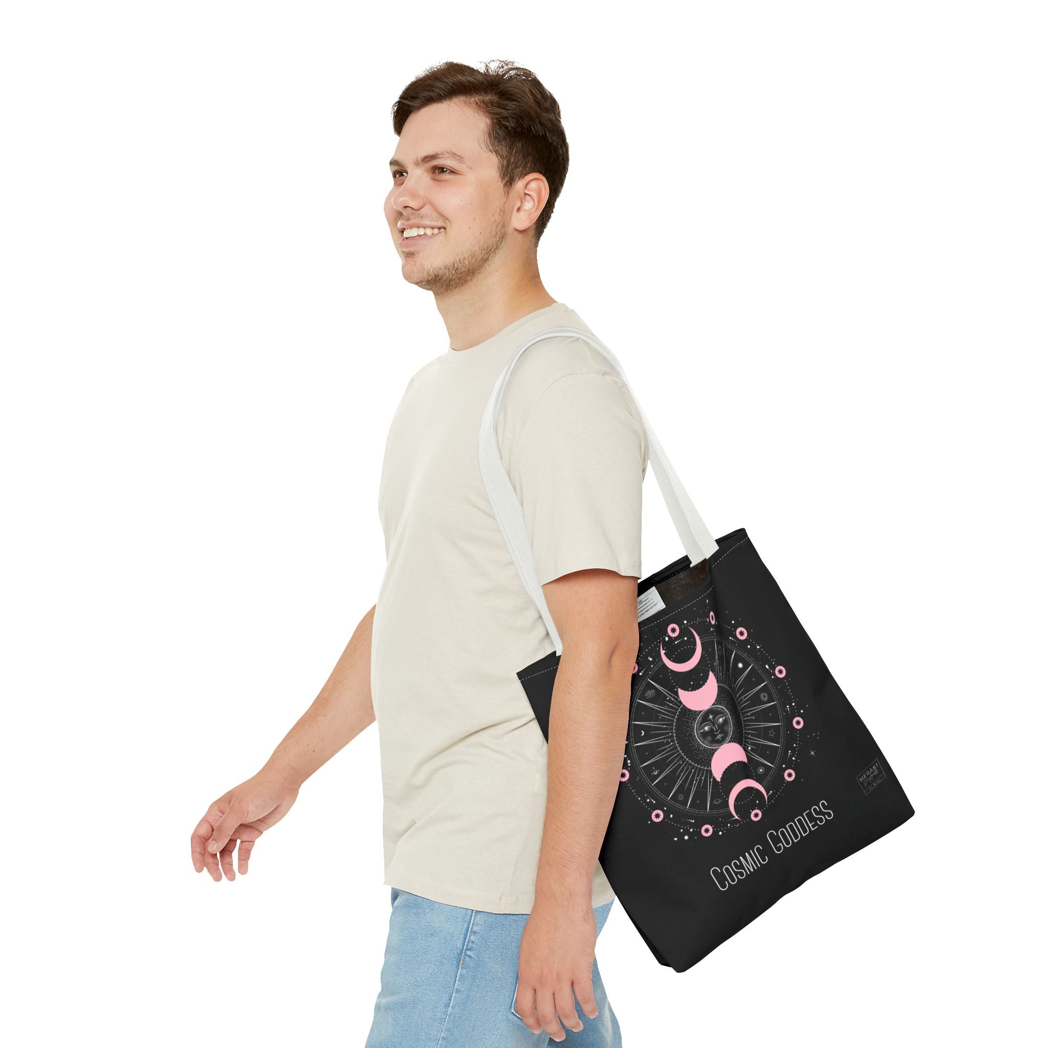 Man wearing white handle tote bag with notebook and moon water bottle inside