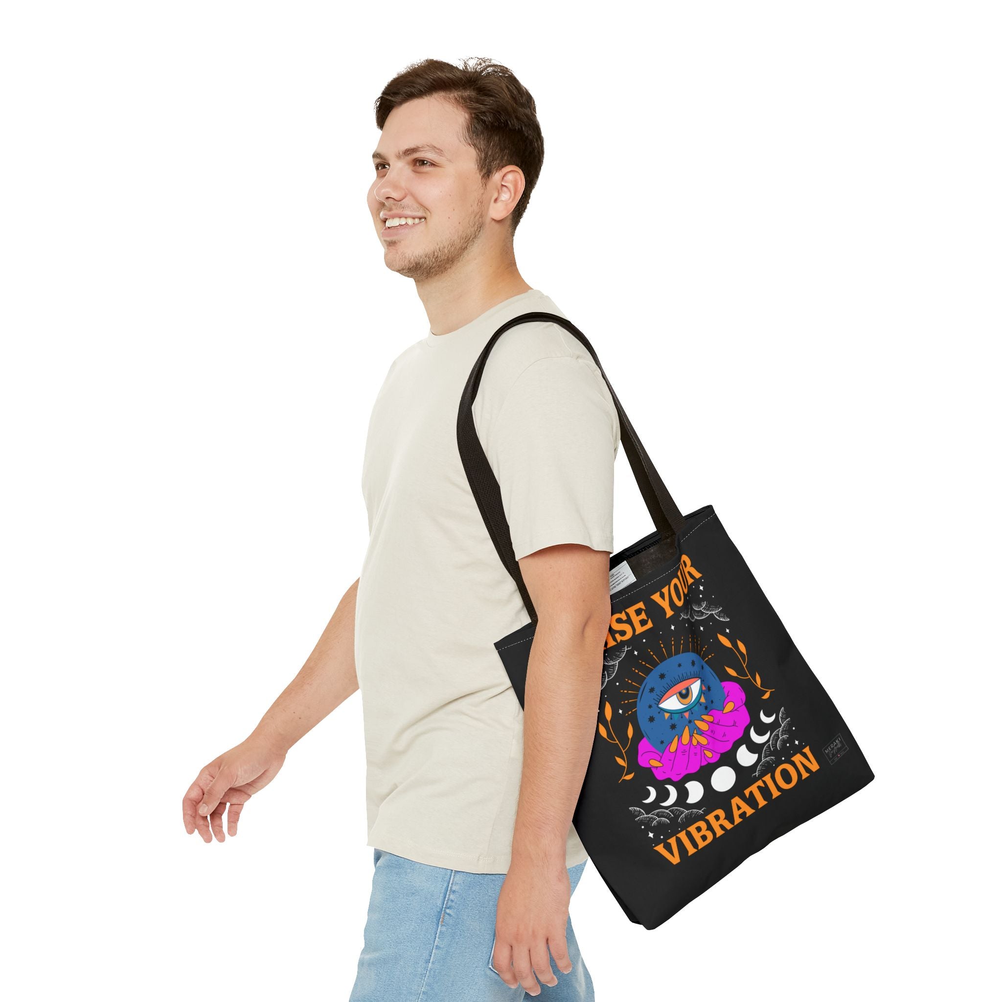 Raise Your Vibration tote bag with black handles front view