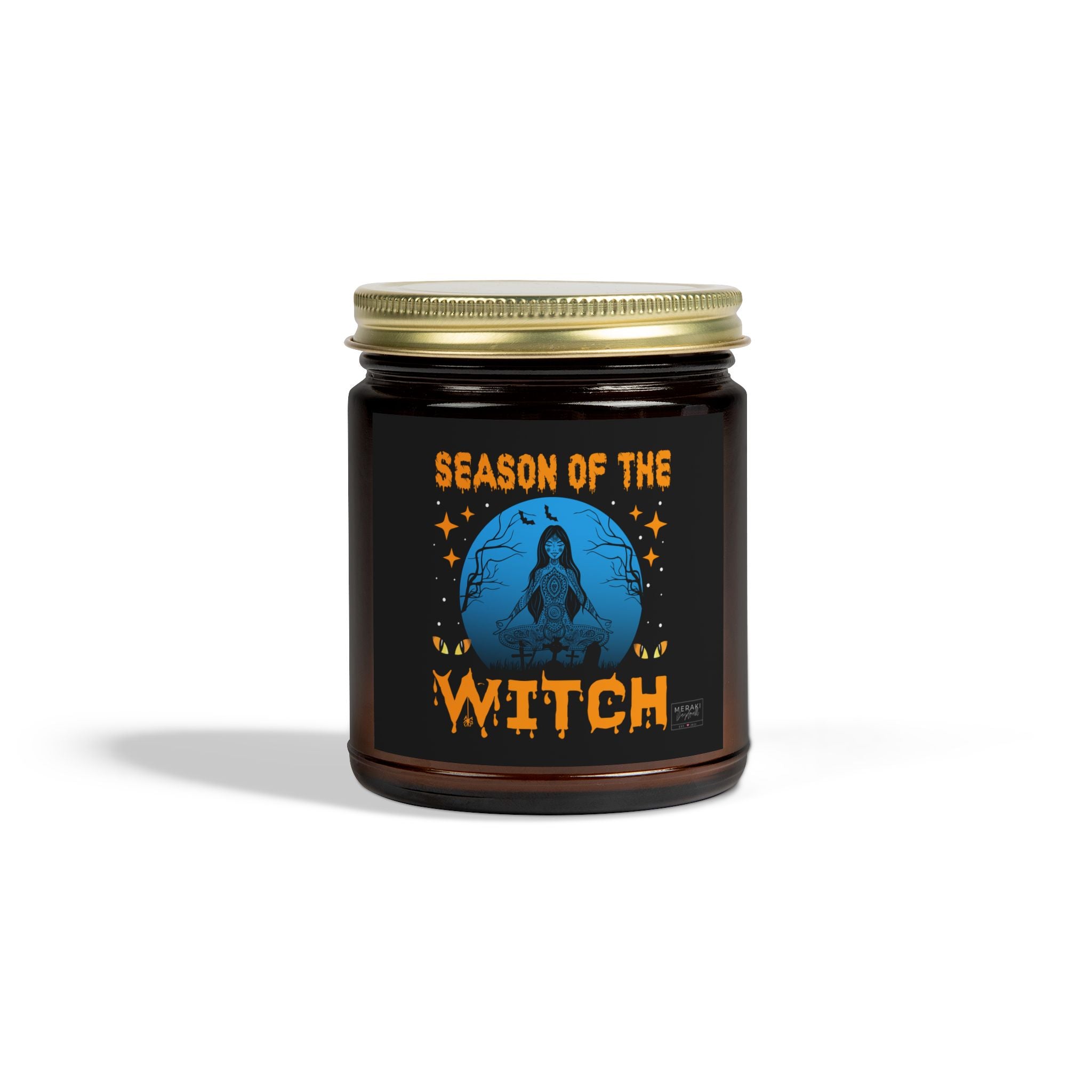 Season of the Witch candle in amber jar with gold lid