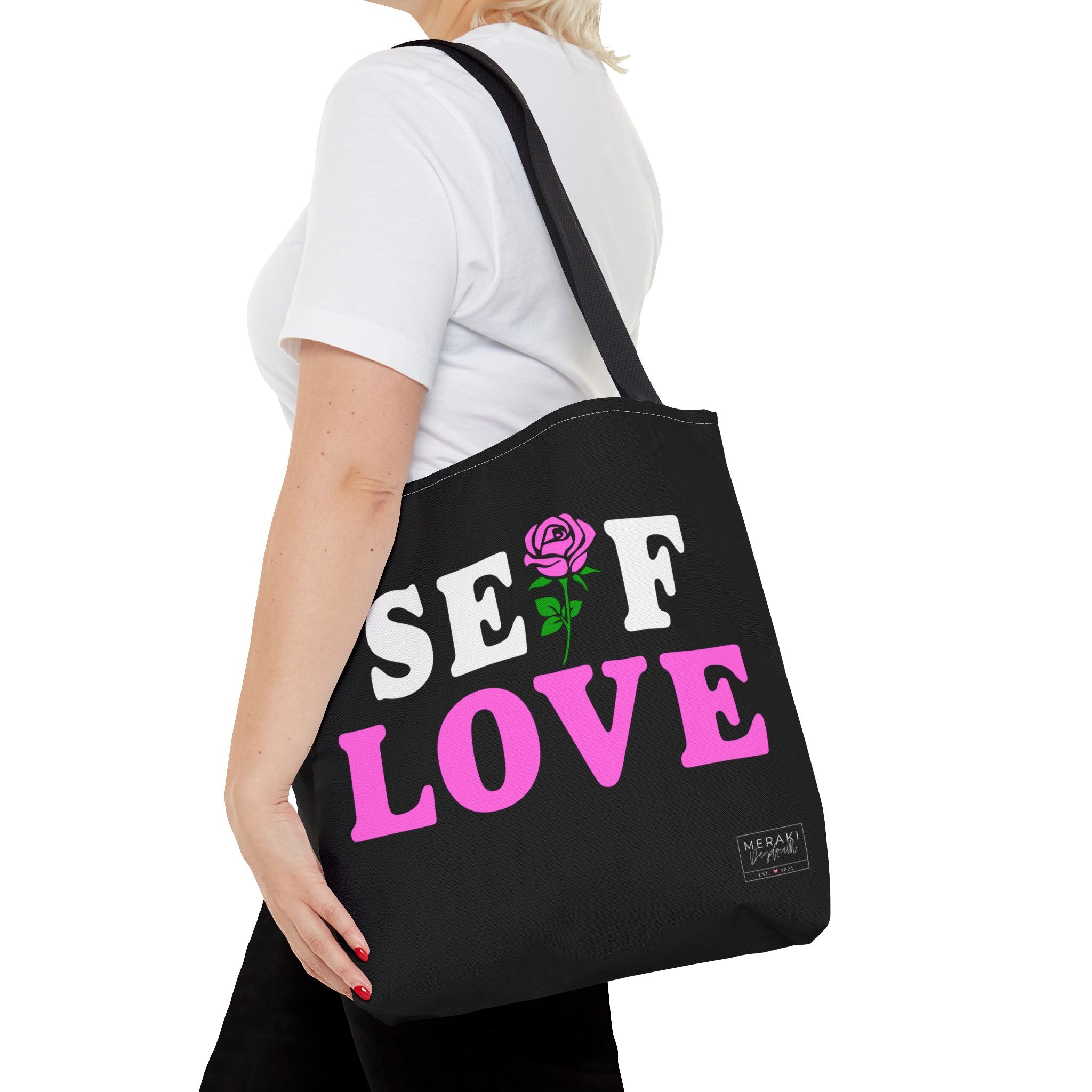 Woman wearing Self Love tote walking
