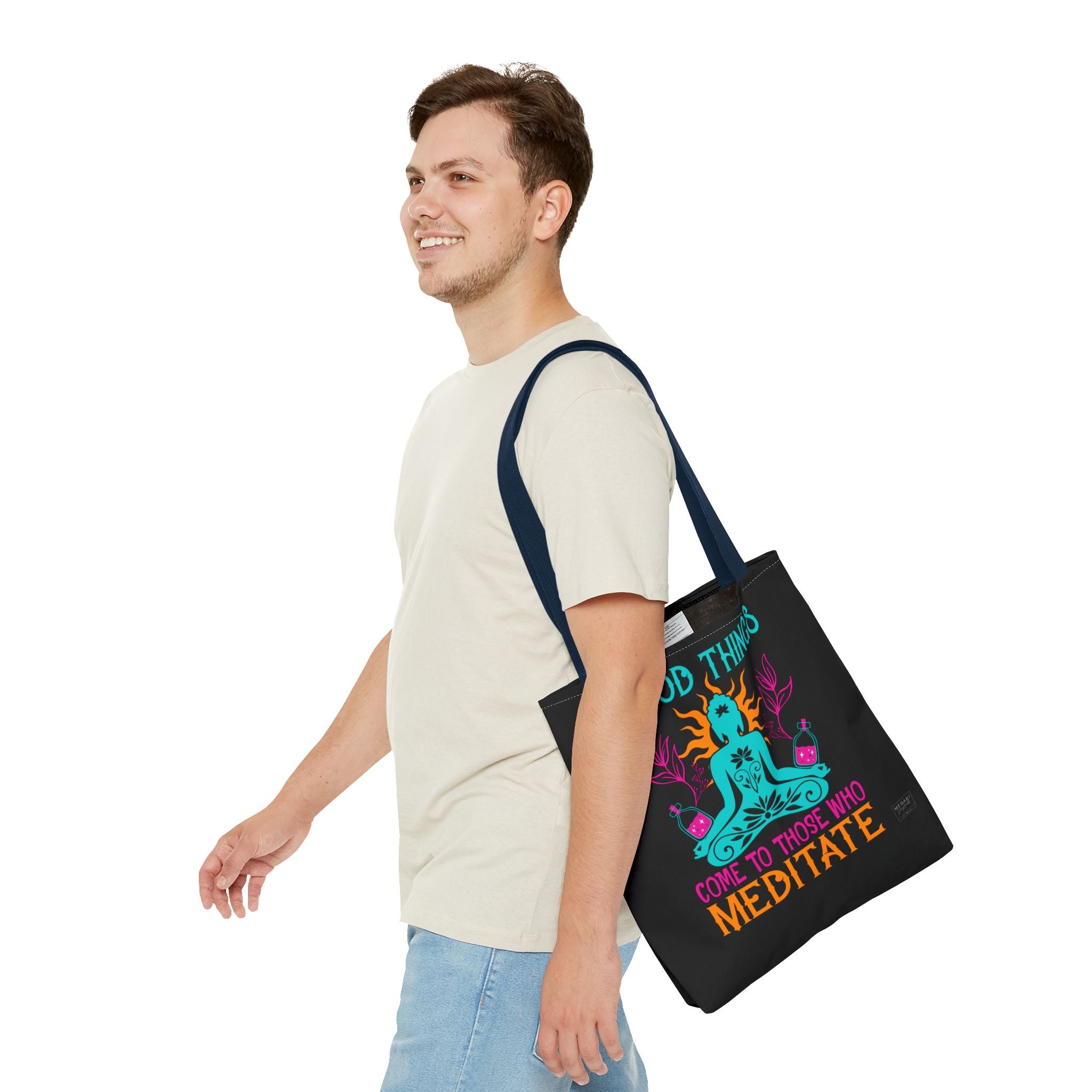 Man using navy tote bag with incense and meditation guide inside