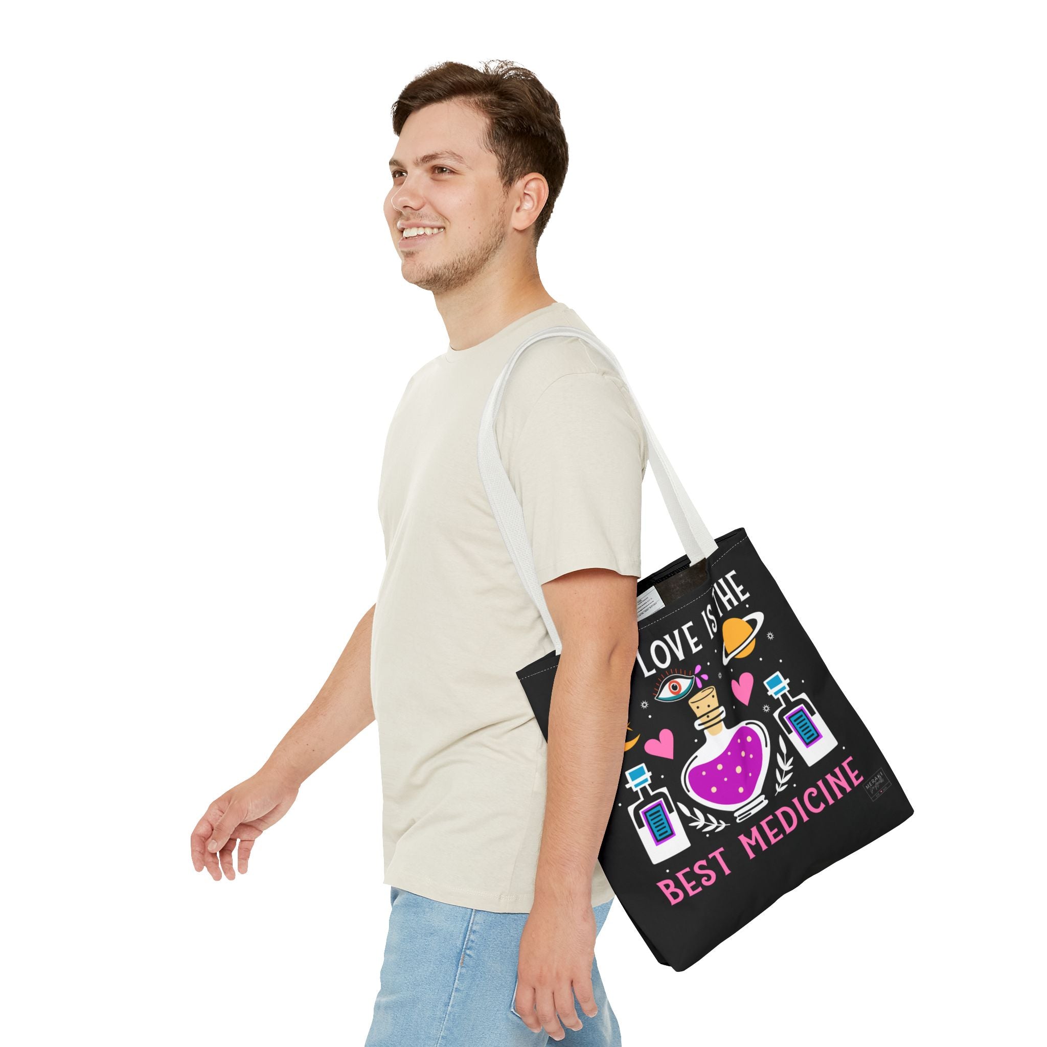 Man using white handle tote bag styled with everyday mindfulness items