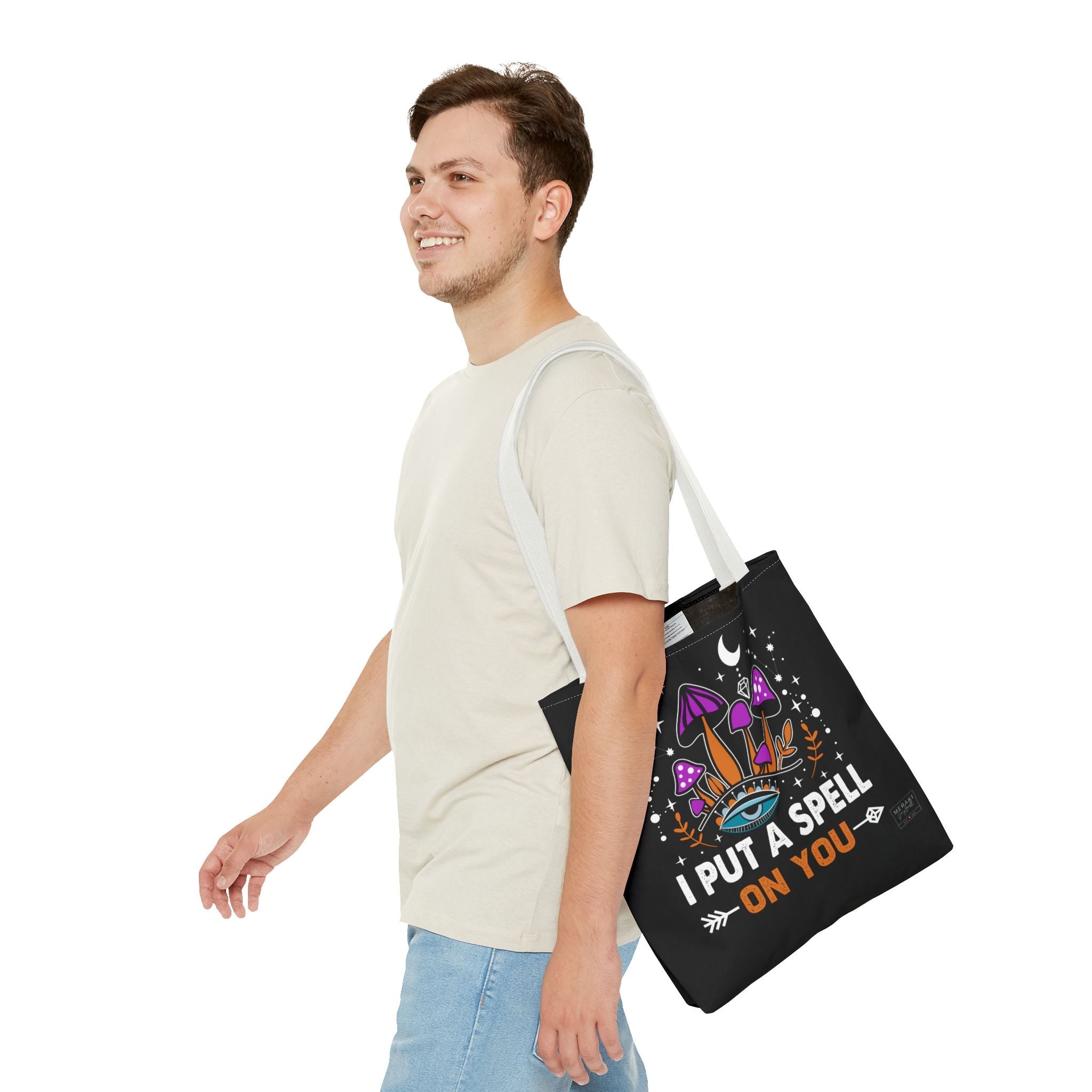 Man using white handle tote with affirmation cards and tea bottle inside