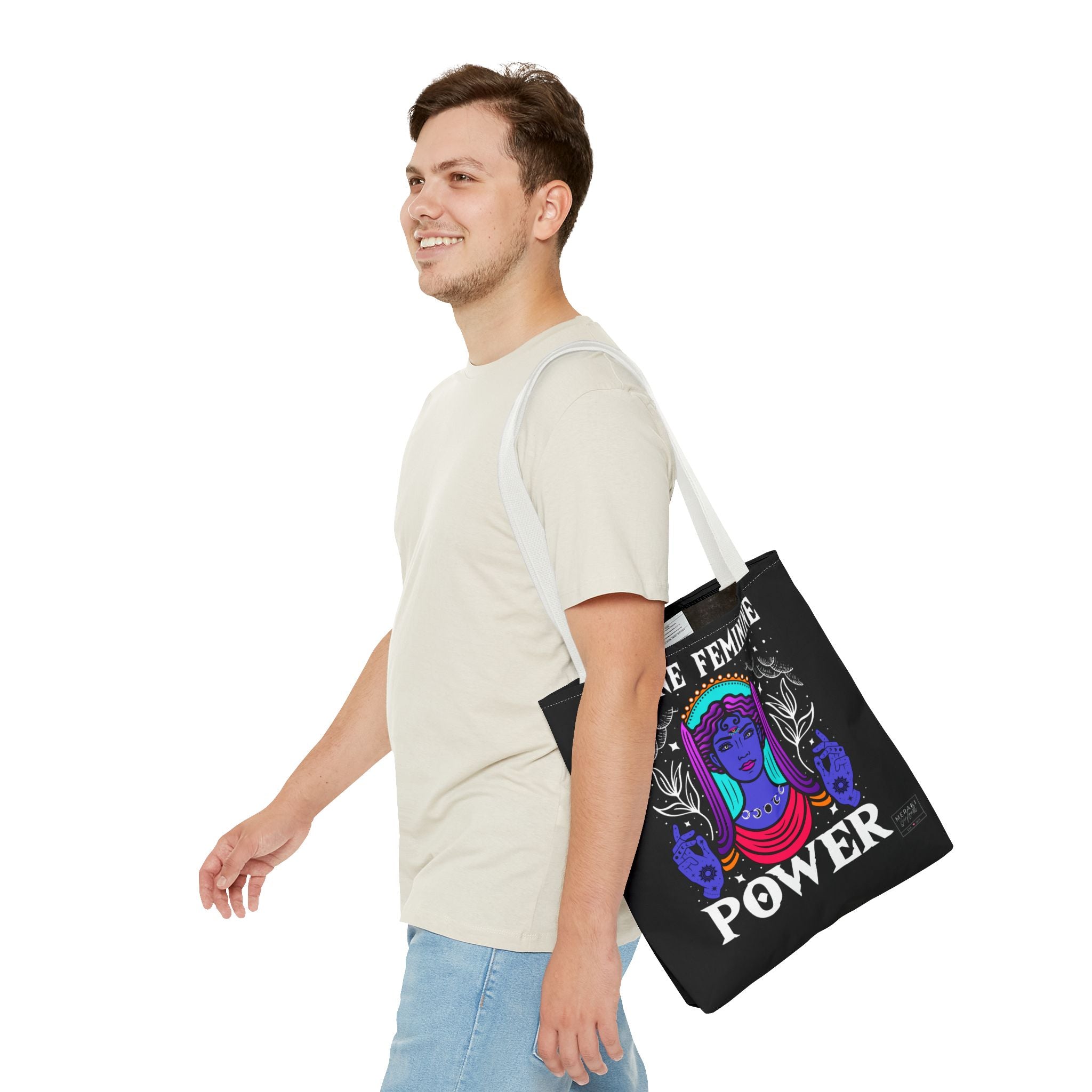 Man wearing white handle spiritual tote with affirmations journal inside