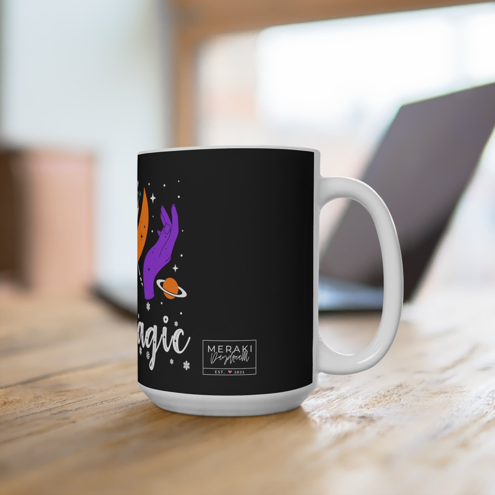 Mug resting on soft blanket near tarot cards and moon water