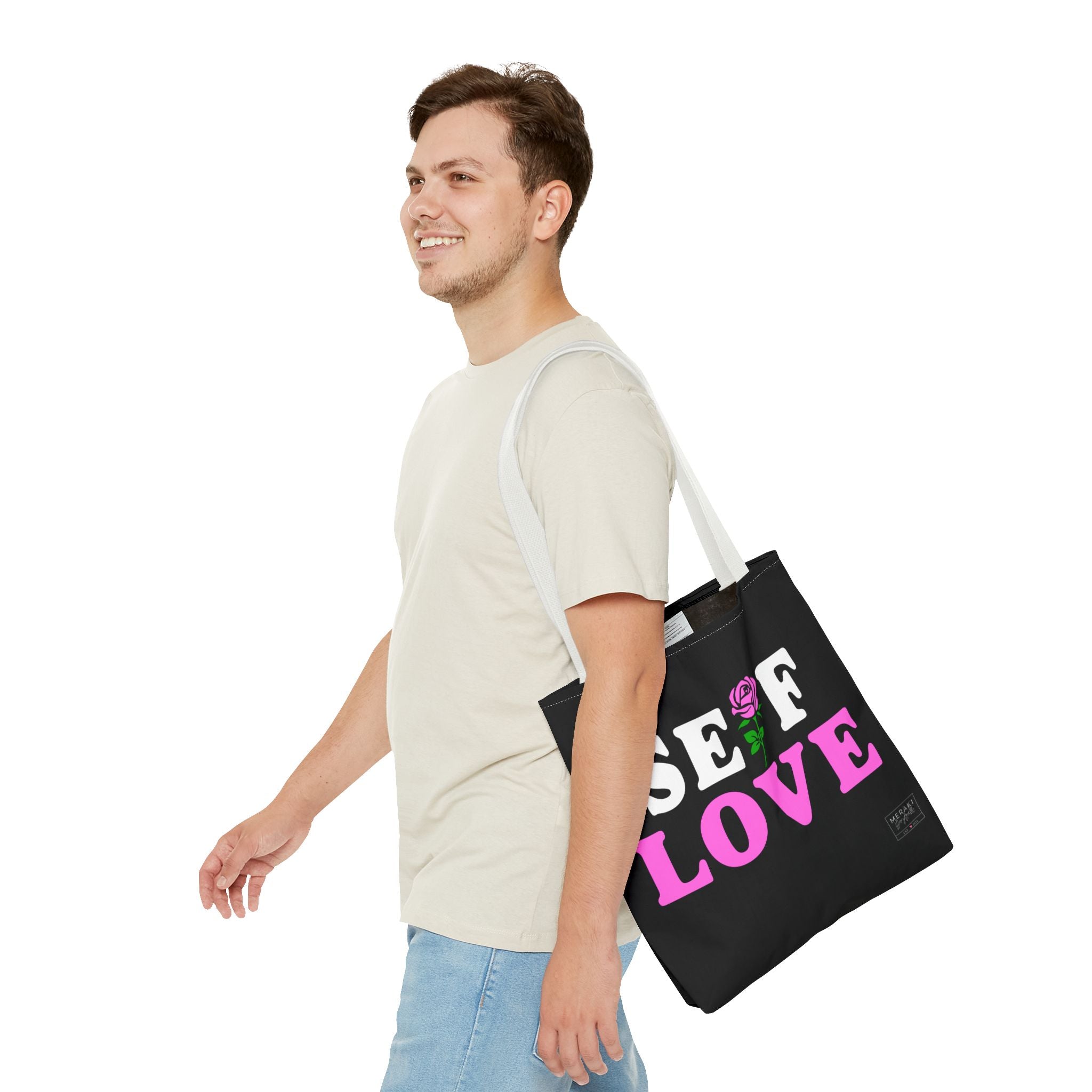White handle Self Love tote carried by man outdoors