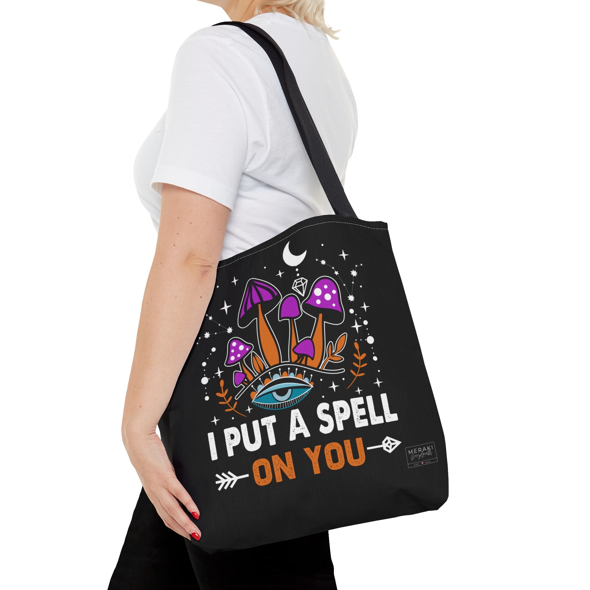 Woman carrying black handle spiritual tote bag with confident posture