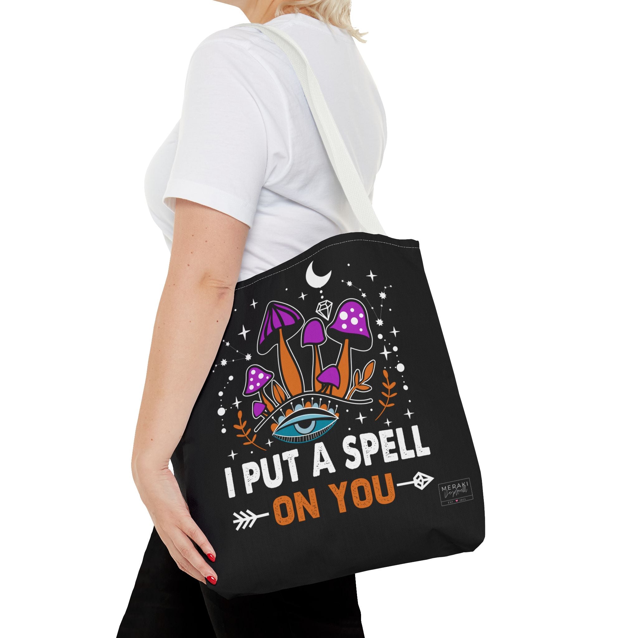 Woman wearing white handle spiritual tote with dark lipstick and calm energy